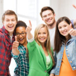 students showing thumbs up at school