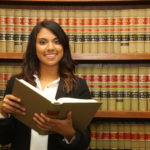 Female law student in law library