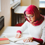 Muslim girl studying read a book